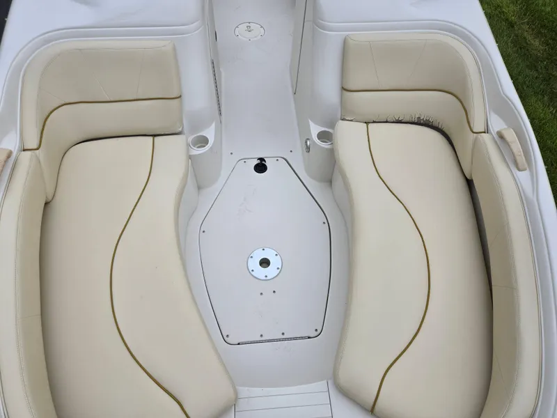 Slide: The Image of 2001 Sea Ray 210 Sundeck interior seating with beige upholstery. - 19