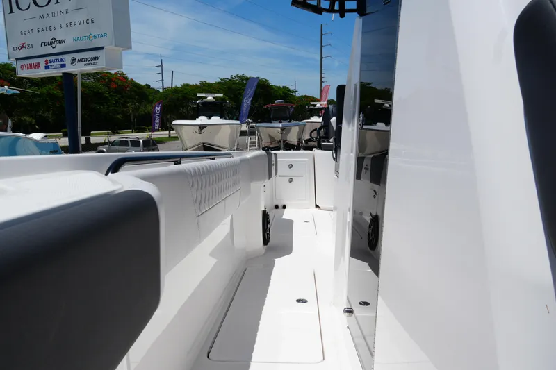 Slide: The Image of 2025 Fountain 32NX boat interior with sleek white design and modern features. - 14