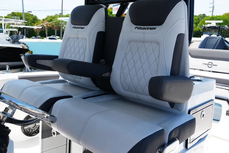 Slide: The Image of Luxury seating on 2025 Fountain 32NX boat, featuring premium upholstery and armrests. - 20
