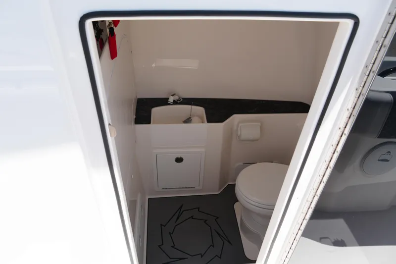 Slide: The Image of Interior of 2025 Fountain 32NX boat bathroom with sink and toilet. - 22