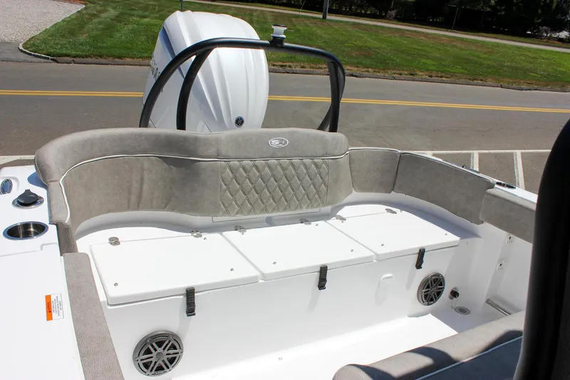 Slide: The Image of 2026 Sea Hunt Ultra 245 SE boat interior with cushioned seating and storage compartments. - 14