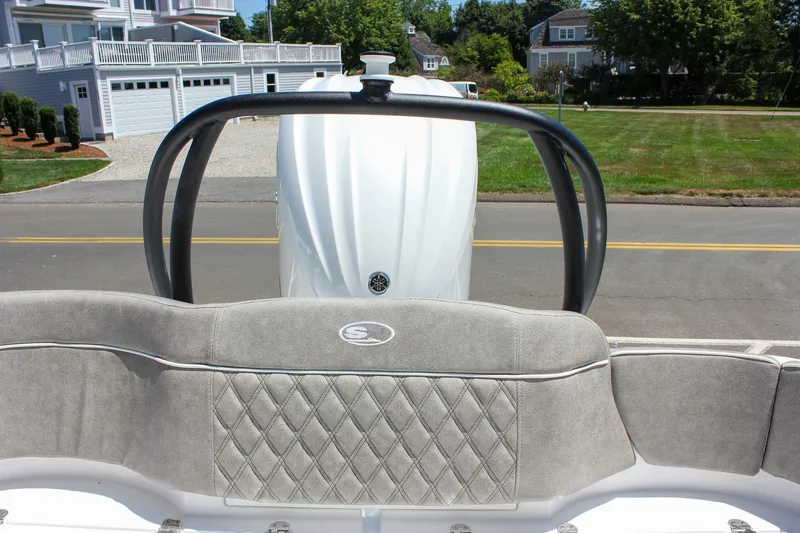 Slide: The Image of 2026 Sea Hunt Ultra 245 SE boat with cushioned seating and sleek design. - 15