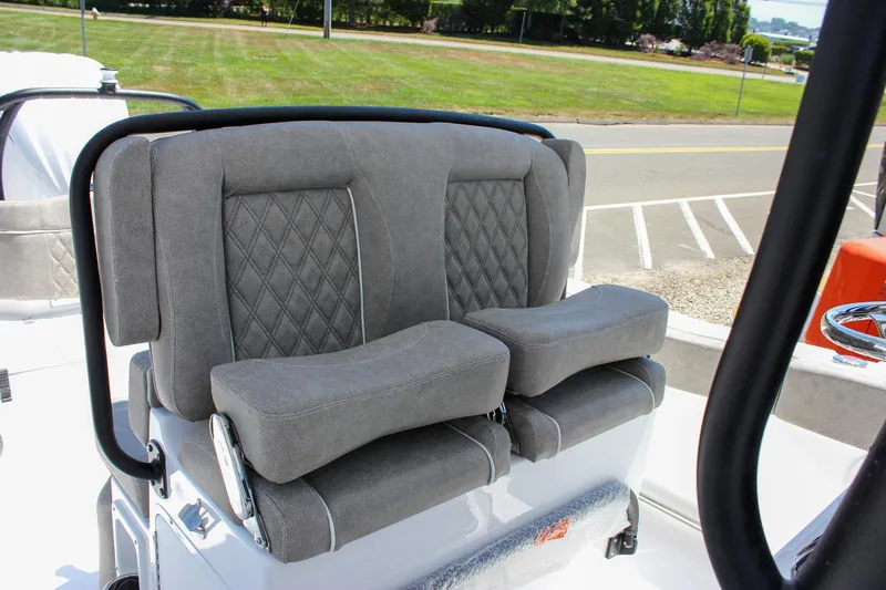 Slide: The Image of Gray cushioned seats on 2026 Sea Hunt Ultra 245 SE boat, featuring diamond stitching. - 24