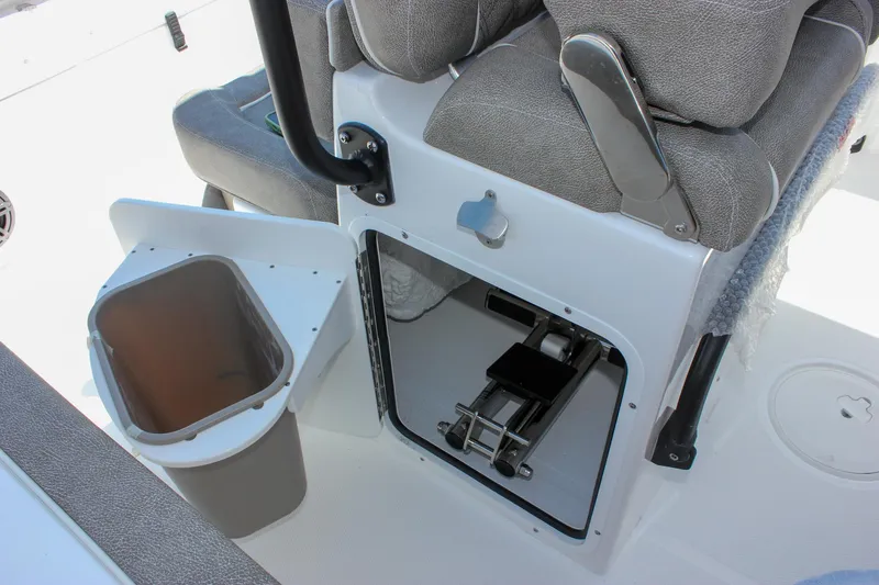 Slide: The Image of 2026 Sea Hunt Ultra 245 SE boat interior with storage compartment and seating. - 27