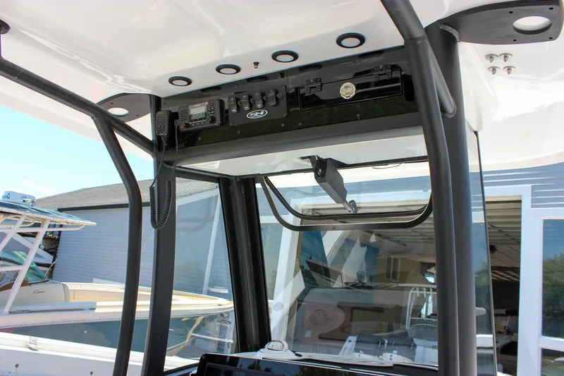 Slide: The Image of Interior view of 2026 Sea Hunt Ultra 245 SE boat's control panel and electronics. - 29