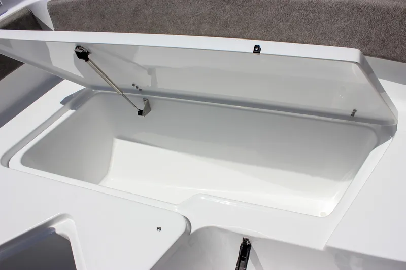 Slide: The Image of Open storage compartment on 2026 Sea Hunt Ultra 245 SE boat. - 38
