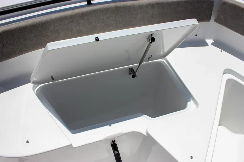 Slide: The Image of Open storage compartment on 2026 Sea Hunt Ultra 245 SE boat. - 39