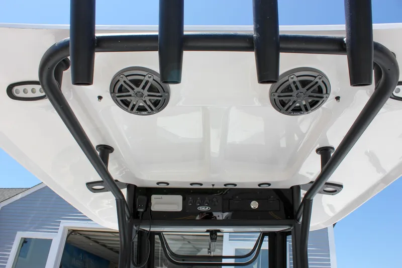 Slide: The Image of T-top view of 2026 Sea Hunt Ultra 245 SE boat with speakers and rod holders. - 4