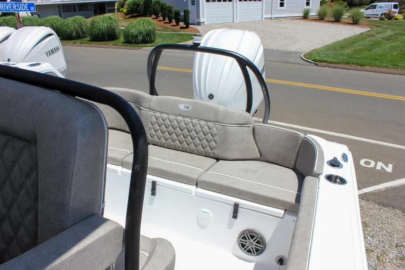Slide: The Image of 2026 Sea Hunt Ultra 245 SE boat interior with cushioned seating and Yamaha engines. - 45