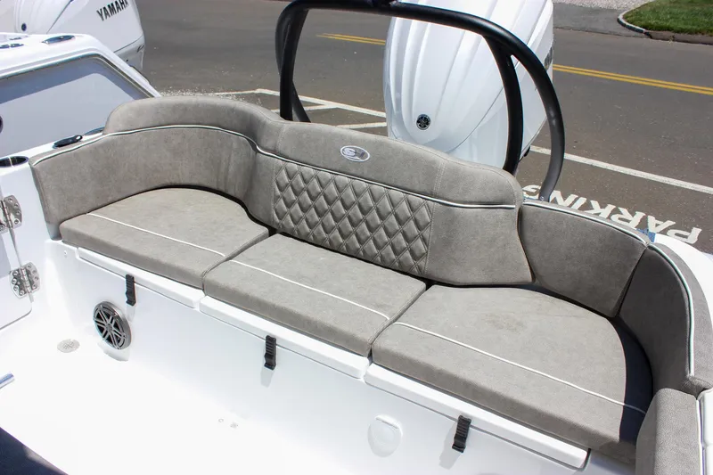 Slide: The Image of 2026 Sea Hunt Ultra 245 SE boat with gray cushioned seating and diamond-patterned backrest. - 46