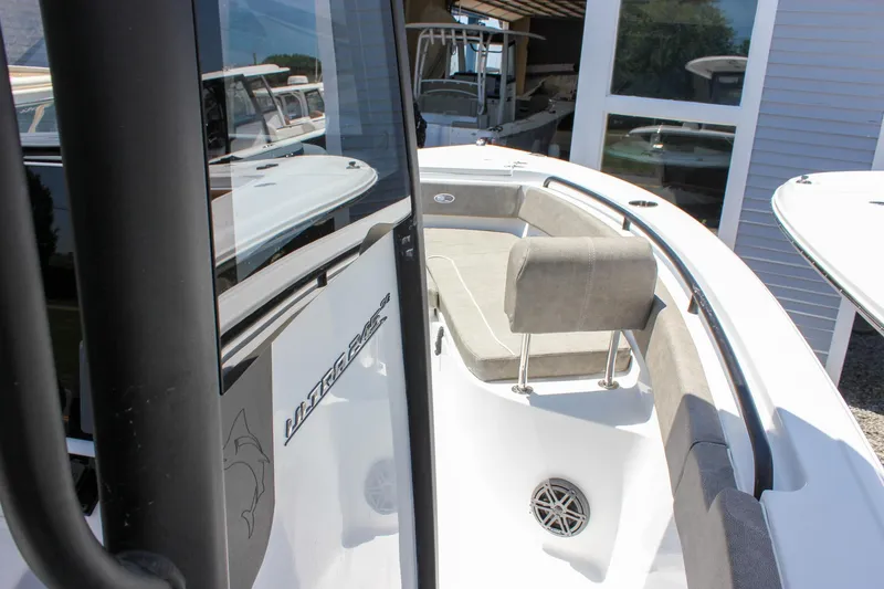 Slide: The Image of 2026 Sea Hunt Ultra 245 SE boat interior with cushioned seating and sleek design. - 48