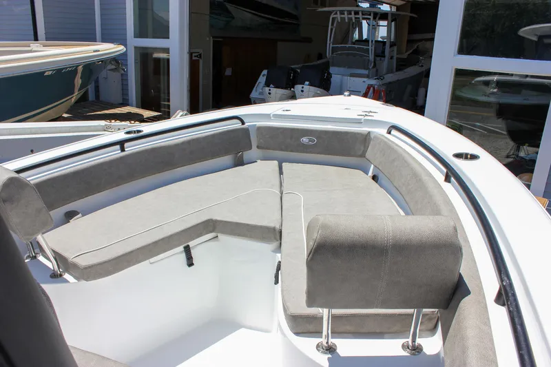 Slide: The Image of 2026 Sea Hunt Ultra 245 SE boat interior with gray seating and modern design. - 49