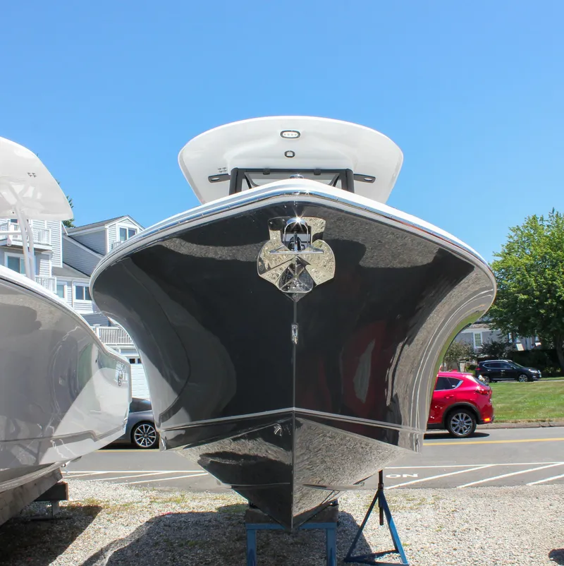Slide: The Image of 2026 Sea Hunt Ultra 245 SE boat on display, front view, sunny day. - 5