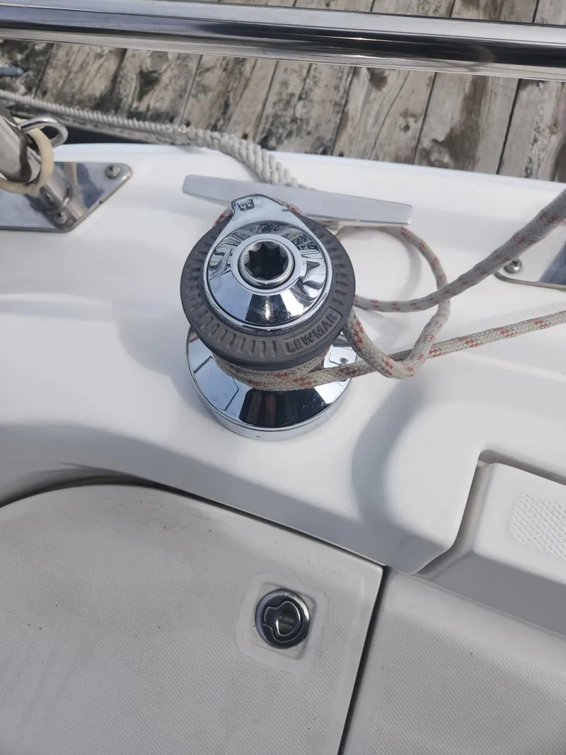 Slide: The Image of Winch on 2004 Hunter 36 sailboat deck with rope and chrome finish. - 10