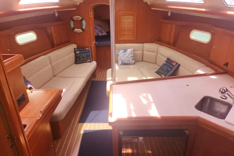 Slide: The Image of Interior of 2004 Hunter 36 sailboat with cozy seating and nautical decor. - 3