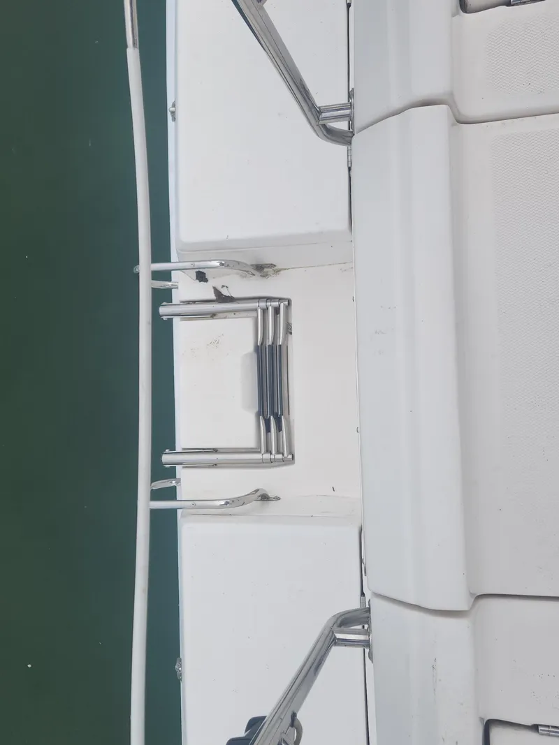 Slide: The Image of Deck view of a 2004 Hunter 36 sailboat with stainless steel ladder. - 31