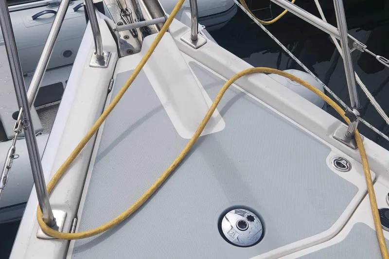Slide: The Image of Deck of 2004 Hunter 36 sailboat with yellow rope and metal fittings. - 34