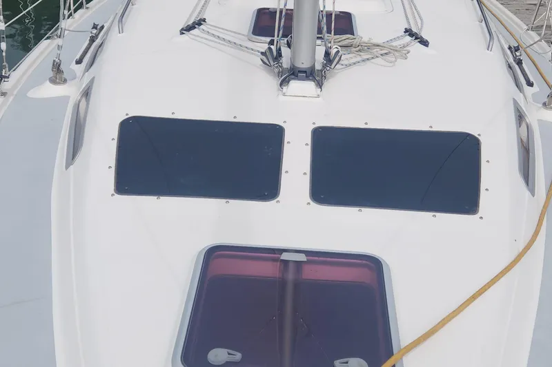 Slide: The Image of 2004 Hunter 36 sailboat deck with hatches and rigging. - 35