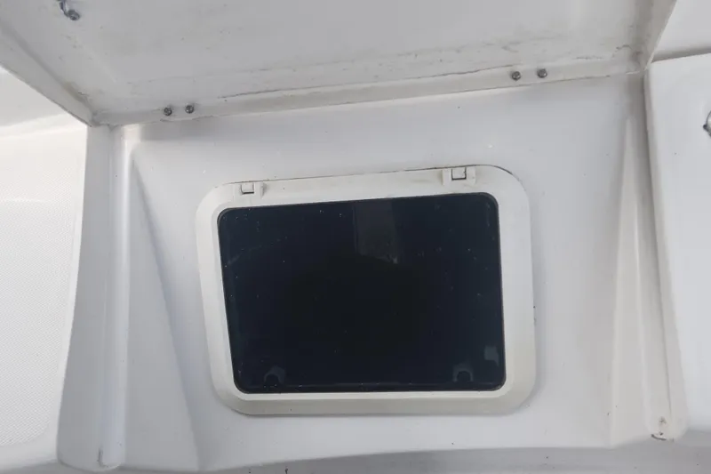 Slide: The Image of Boat hatch window on a 2004 Hunter 36 sailboat, closed and secured. - 38