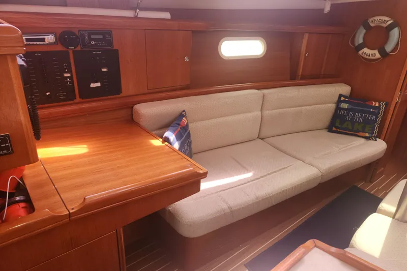 Slide: The Image of Interior of 2004 Hunter 36 sailboat with cozy seating and nautical decor. - 4