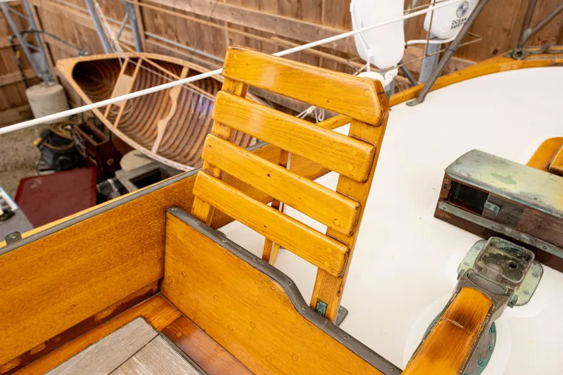Slide: The Image of Wooden seat on a 1964 Concordia 39 sailboat, showcasing classic craftsmanship. - 41