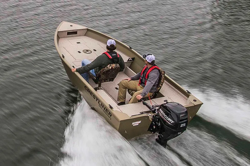 Slide: The Image of Manufacturer Provided Image: 2020 Crestliner 1450 Discovery Tiller boat on water with two passengers. - 13