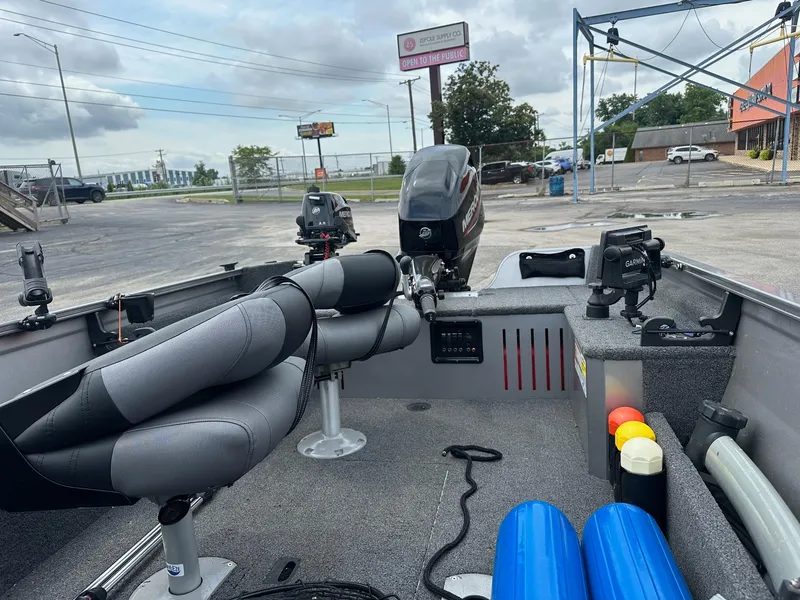 Slide: The Image of 2020 Crestliner 1450 Discovery Tiller boat interior with motor and equipment. - 3