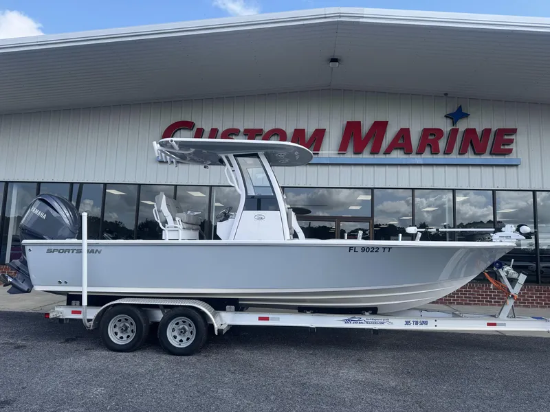 The Image of 2024 Sportsman Masters 247OE Bay Boat on trailer at Custom Marine dealership. - 0