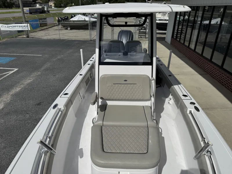 Slide: The Image of 2024 Sportsman Masters 247OE Bay Boat with cushioned seating and sleek design. - 8