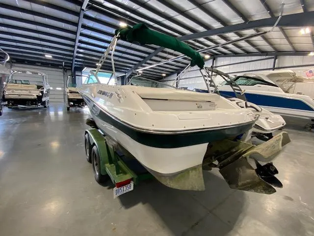 Slide: The Image of 2000 Four Winns 200 Horizon boat in indoor storage facility. - 6