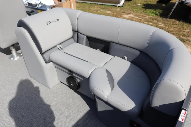 Slide: The Image of 2025 Bentley Pontoons 220 Navigator, luxurious gray seating, outdoor setting. - 7