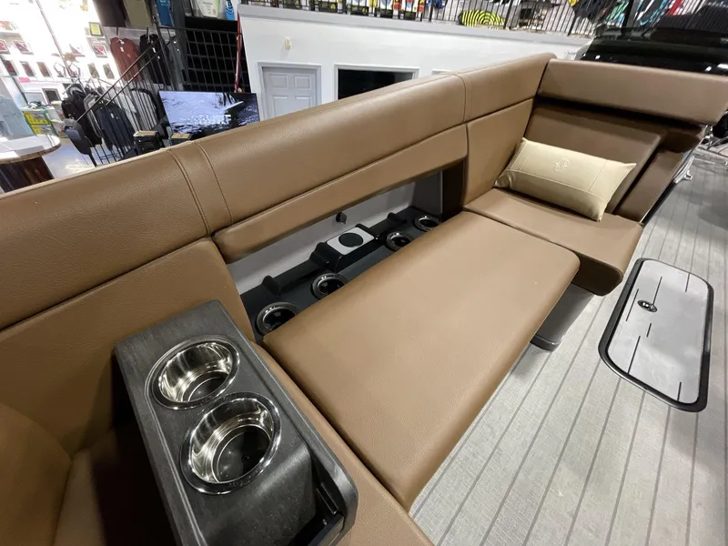 Slide: The Image of Luxurious seating on 2025 Balise Horizon 26C boat with cup holders and cushion. - 17