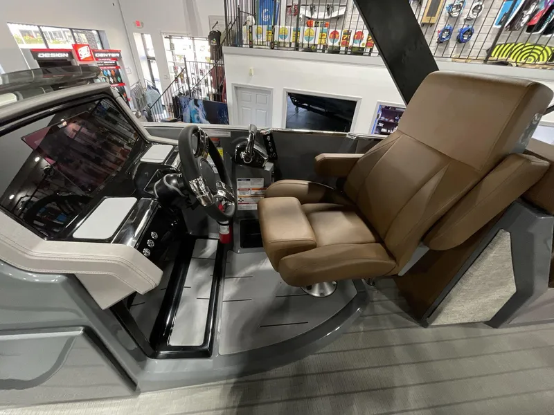 Slide: The Image of Captain's seat and helm of 2025 Balise Horizon 26C boat, featuring modern controls and design. - 20