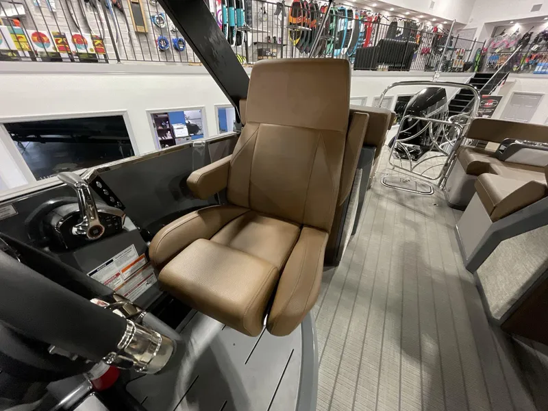 Slide: The Image of Captain's chair on 2025 Balise Horizon 26C boat, featuring luxurious brown upholstery. - 23