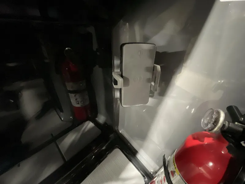 Slide: The Image of Fire extinguisher inside Balise Horizon 26C vehicle, 2025 model, with interior lighting. - 24