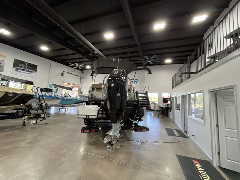 Slide: The Image of Indoor showroom displaying a 2025 Balise Horizon 26C boat with modern design. - 4