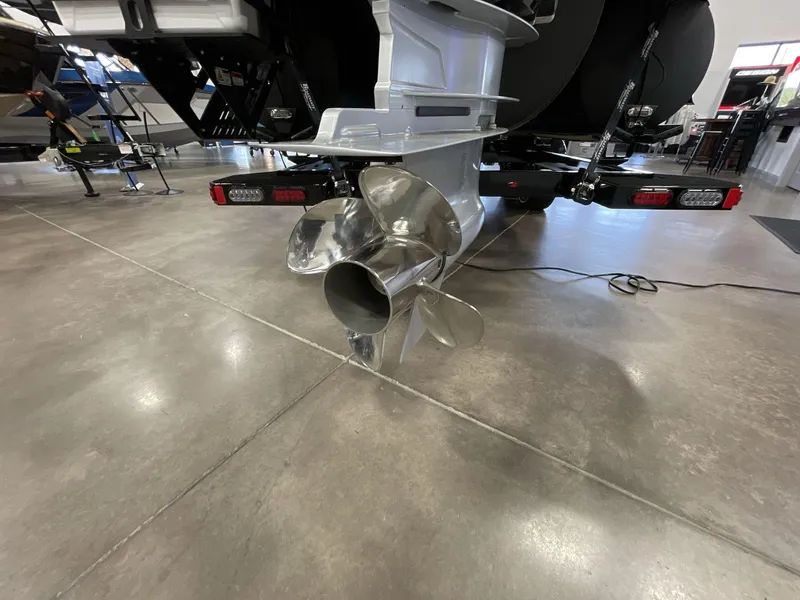 Slide: The Image of Propeller of 2025 Balise Horizon 26C boat in showroom setting. - 5