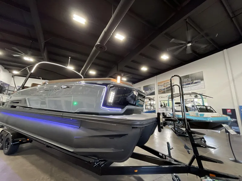 Slide: The Image of 2025 Balise Horizon 26C boat displayed indoors with modern design and LED lighting. - 8