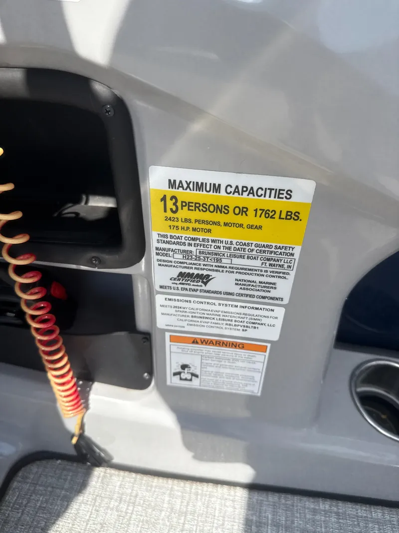 Slide: The Image of 2024 Harris Cruiser 230 capacity label, maximum 13 persons or 1762 lbs, 175 HP motor. - 10