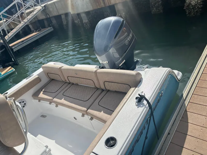 Slide: The Image of 2019 Sportsman Heritage 241 Center Console boat docked with Yamaha outboard motor. - 5