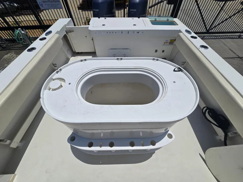 Slide: The Image of 2019 Parker 2520 DV boat deck with livewell and storage compartments. - 15