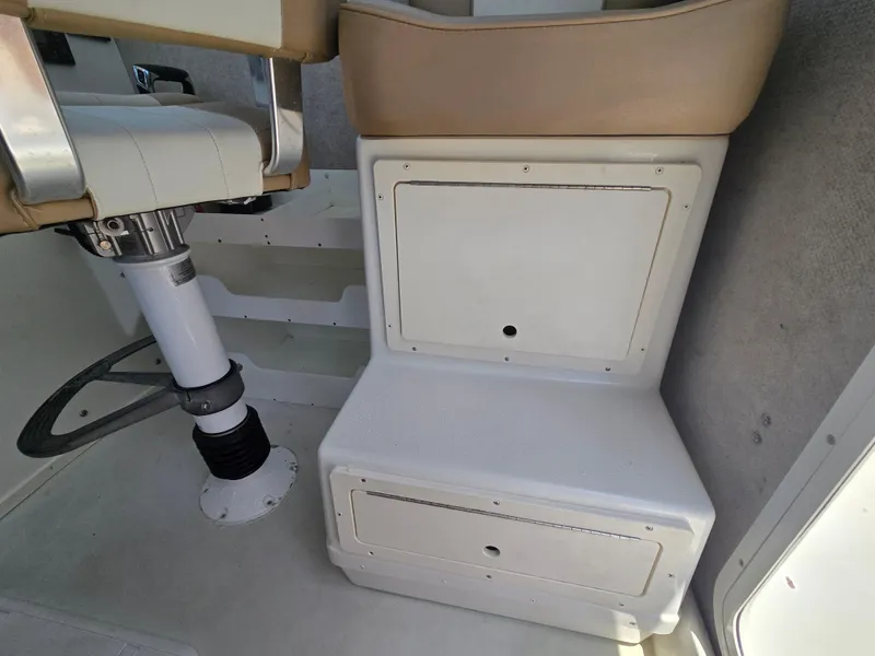 Slide: The Image of Interior of 2019 Parker 2520 DV boat showing seating and storage compartments. - 24