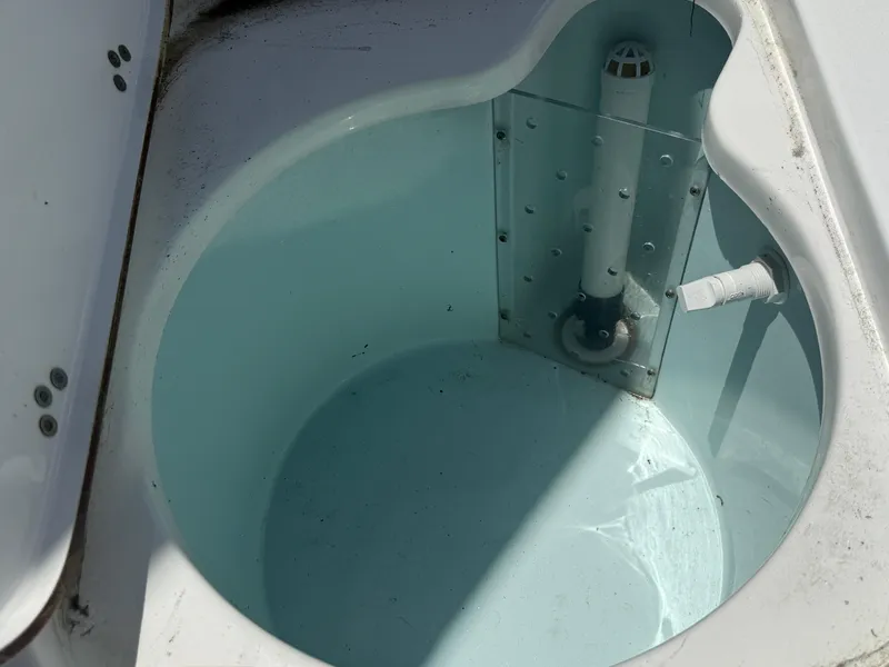 Slide: The Image of Livewell in 2018 Sea Pro 228 Bay boat, featuring clean water and drainage system. - 11