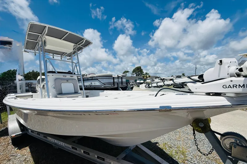 Slide: The Image of 2018 Sea Pro 228 Bay boat on trailer under blue sky. - 3