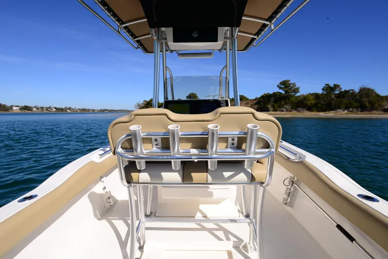 Slide: The Image of 2020 Key West 219 FS boat interior with rod holders, on calm water. - 13