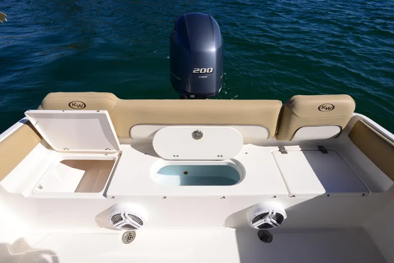 Slide: The Image of 2020 Key West 219 FS boat stern with Yamaha 200 engine and storage compartments. - 15
