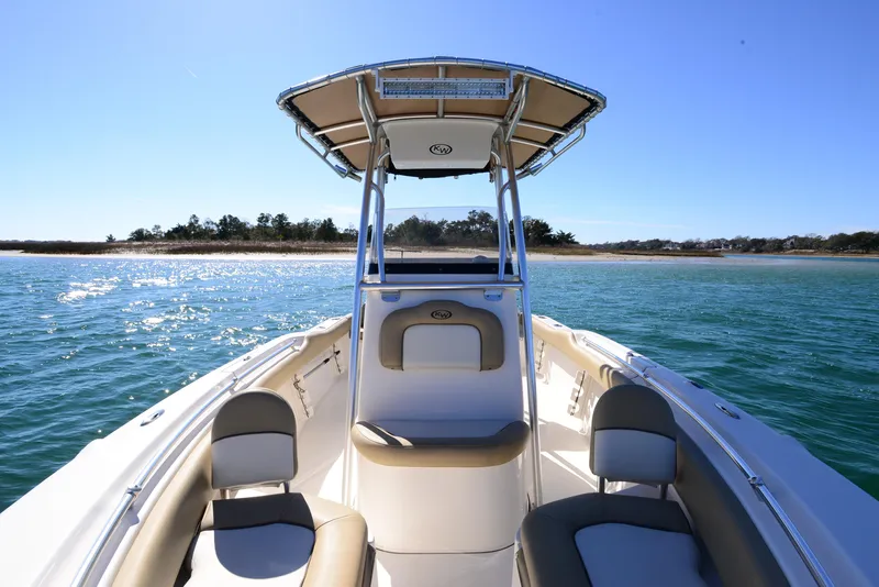 Slide: The Image of 2020 Key West 219 FS boat on water, sunny day, clear blue sky. - 9