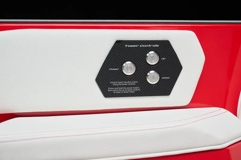 Slide: The Image of 2026 Nautique Super Air Nautique GS22 tower controls on red and white interior panel. - 14