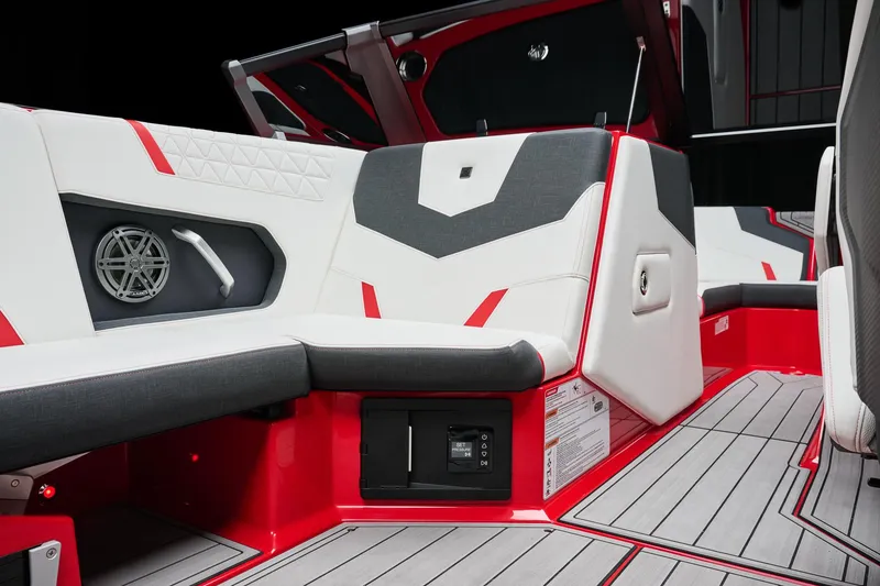 Slide: The Image of 2026 Nautique Super Air Nautique GS22 interior with red and white seating, modern design. - 4