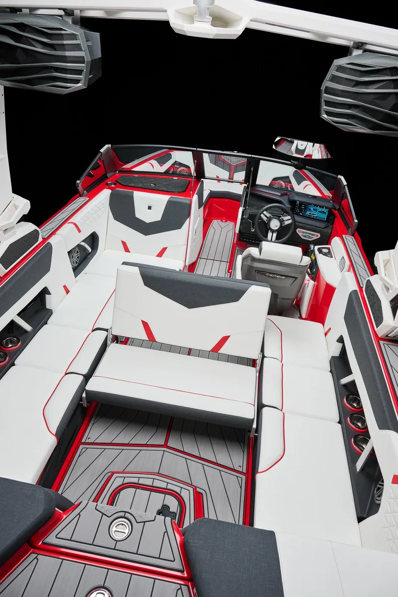 Slide: The Image of 2026 Nautique Super Air Nautique GS22 interior, featuring sleek red and white seating design. - 5